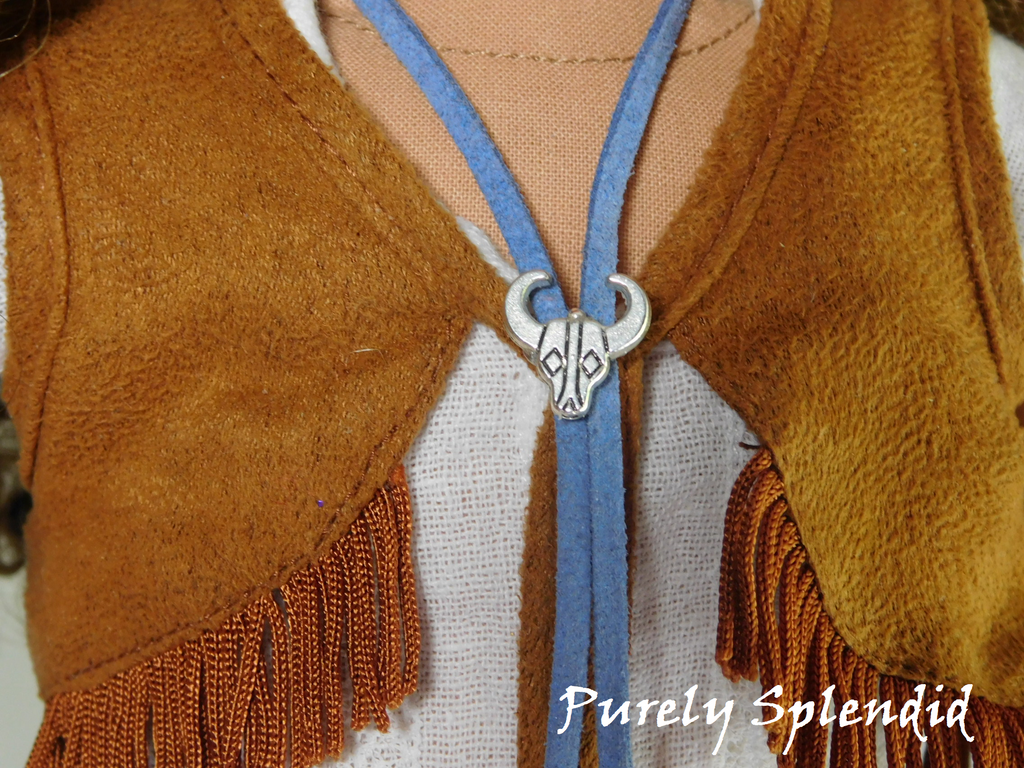 18 inch doll shown wearing the blue Western Bolo with silver steer head