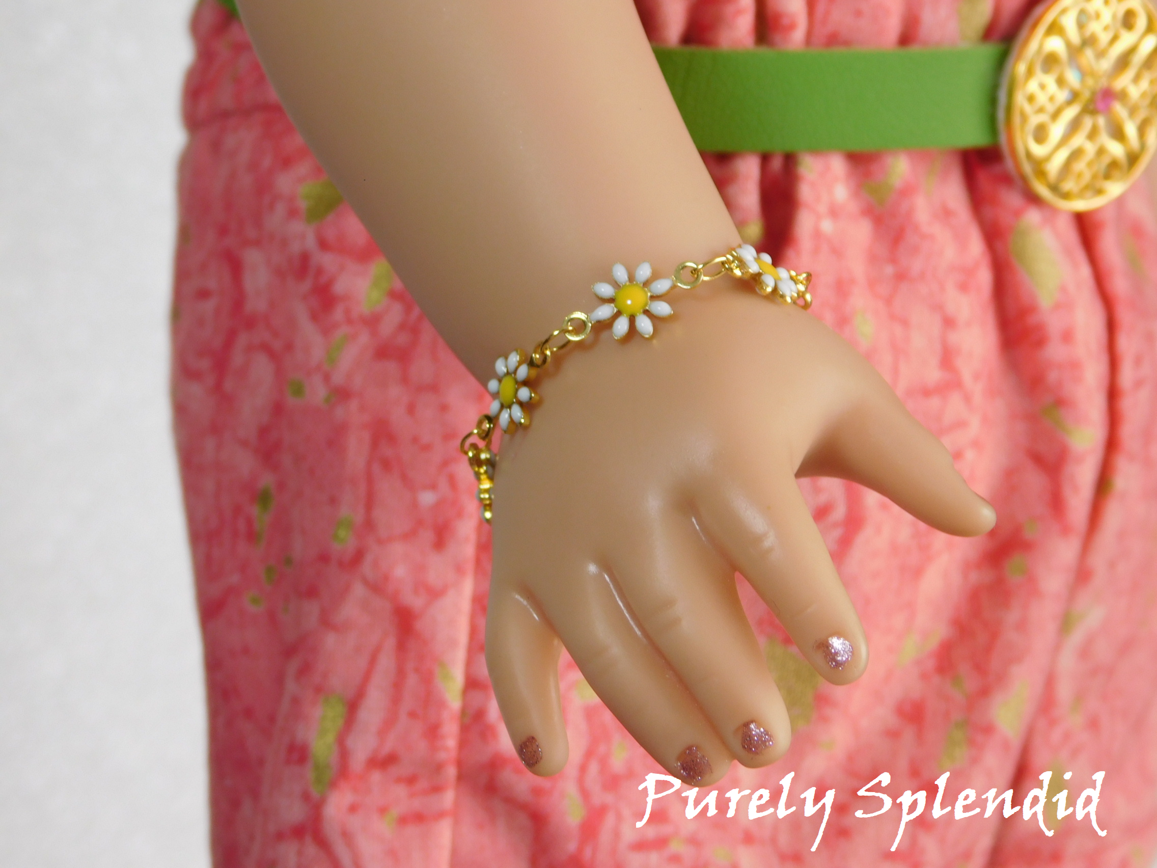 18 inch doll shown wearing a dainty daisy bracelet