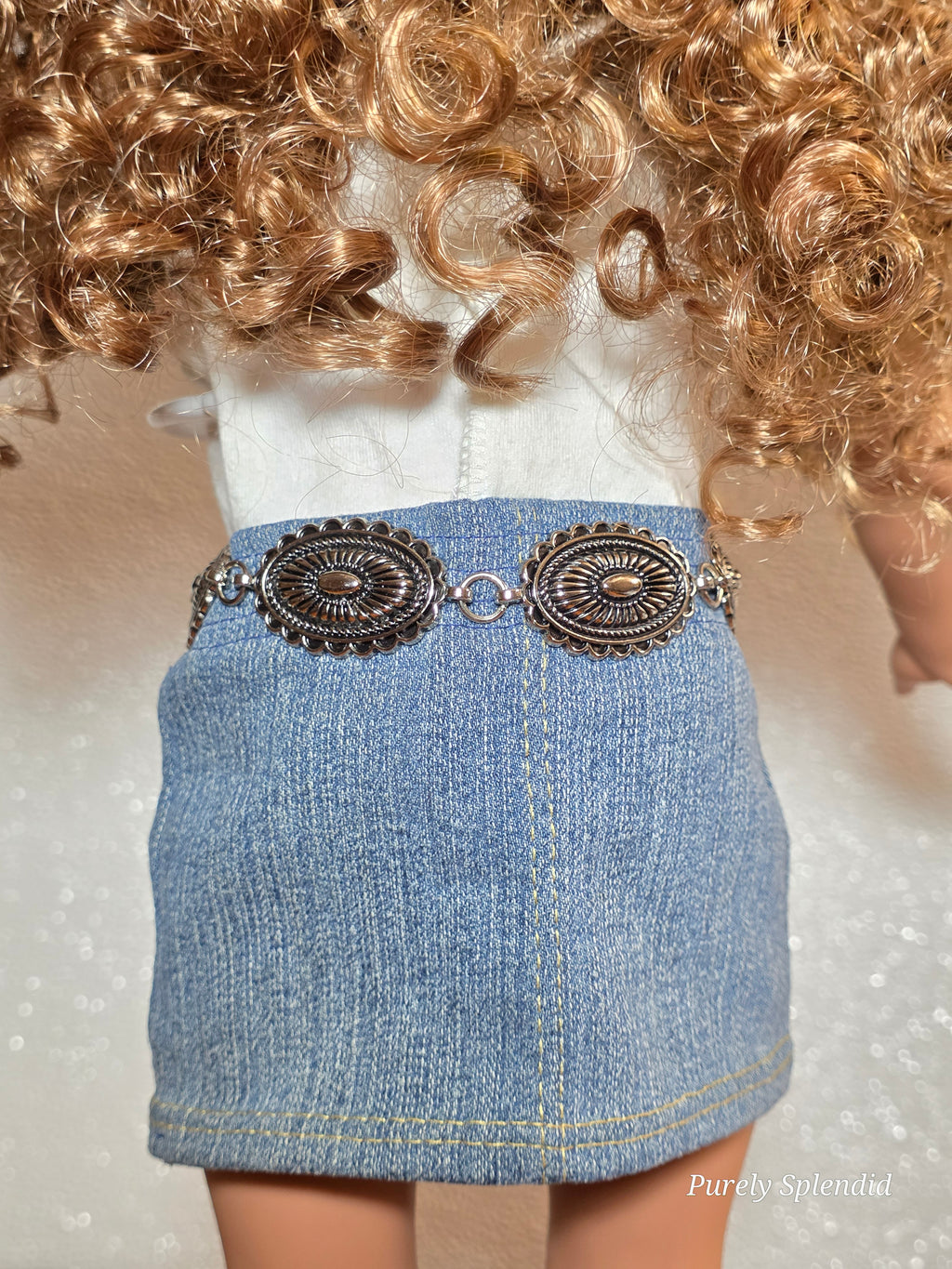 Close-up of silver concho links on Western belt for 18 inch girl doll, American made | Purely Splendid
