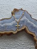 Detail of gold cross pendant on necklace for 18 inch girl dolls | Purely Splendid
