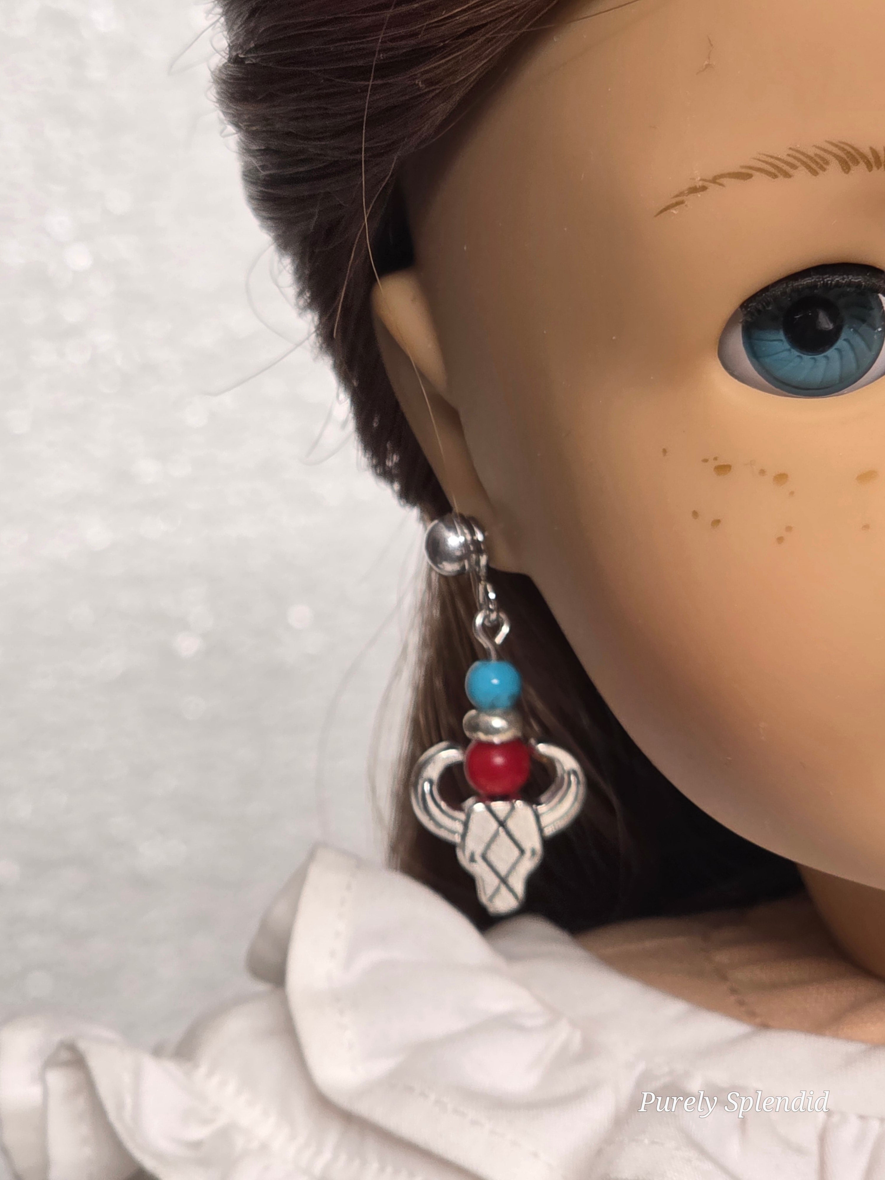18 inch girl doll wearing a pair of Western Longhorn Earrings and silver 2mm studs / American made / Purely Splendid