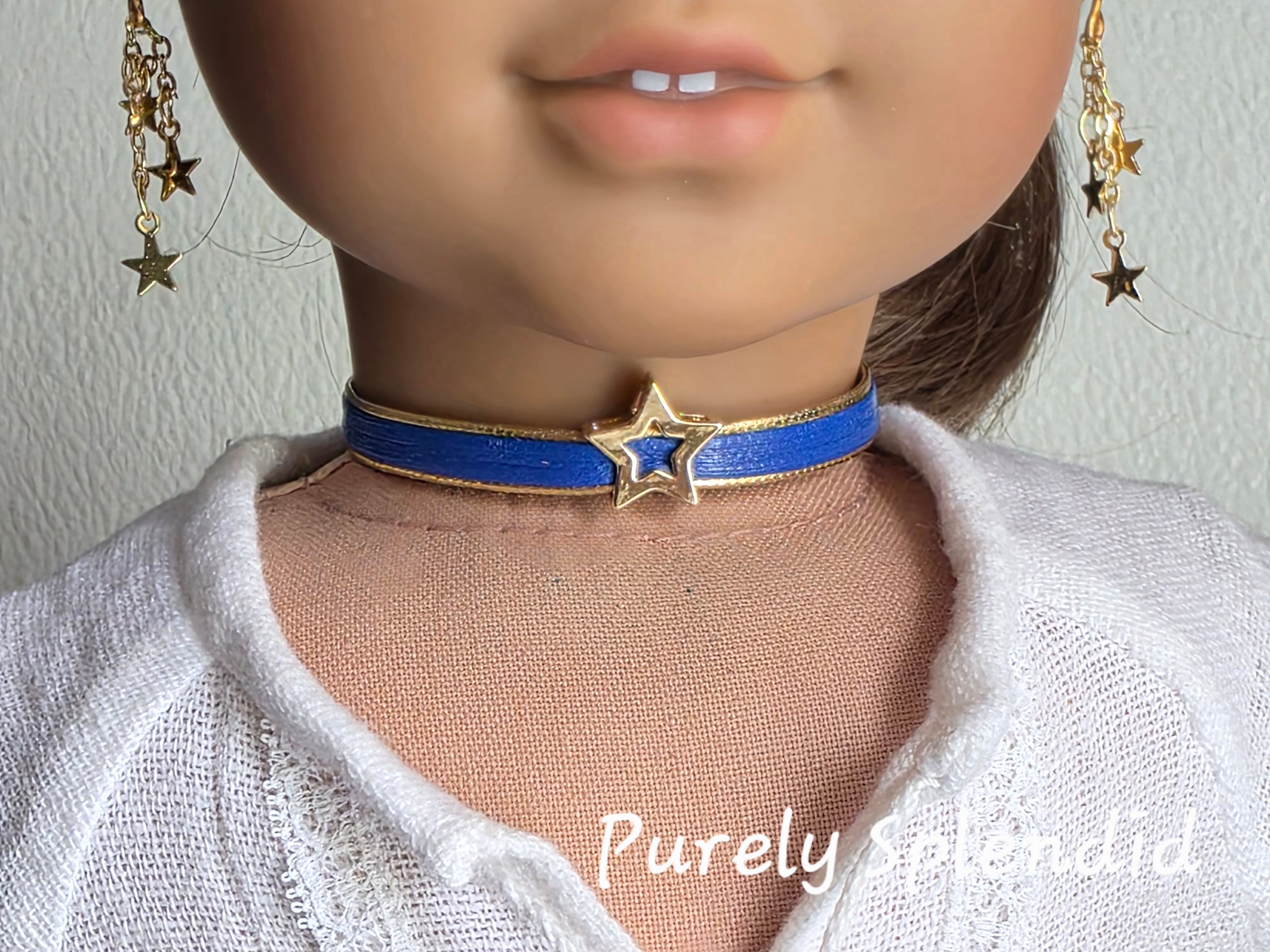 18 inch girl doll wearing a gold star choker with blue band American made / Purely Splendid