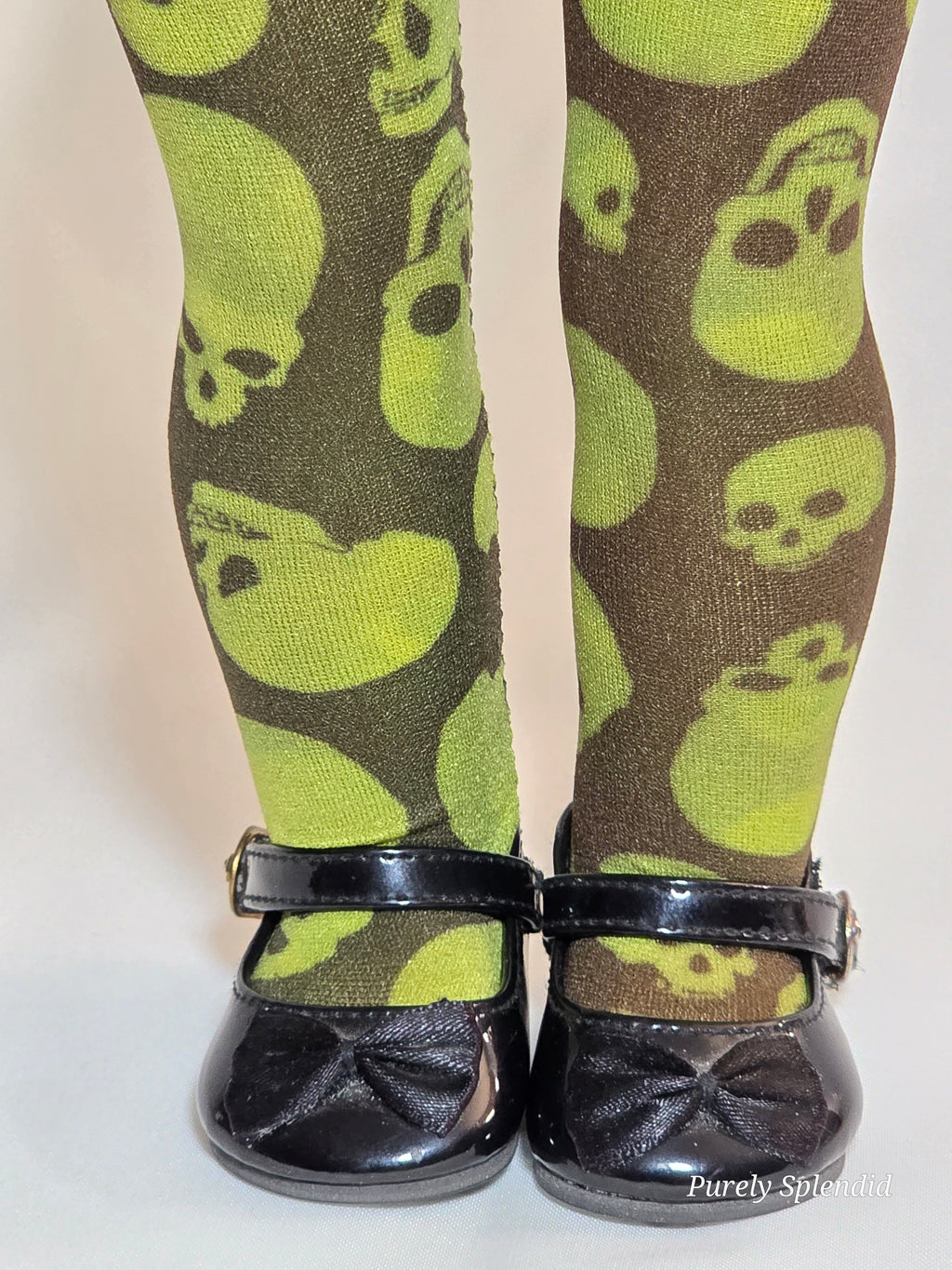 18 inch girl doll wearing a pair of green Halloween Skull Tights / American made / Purely Splendid