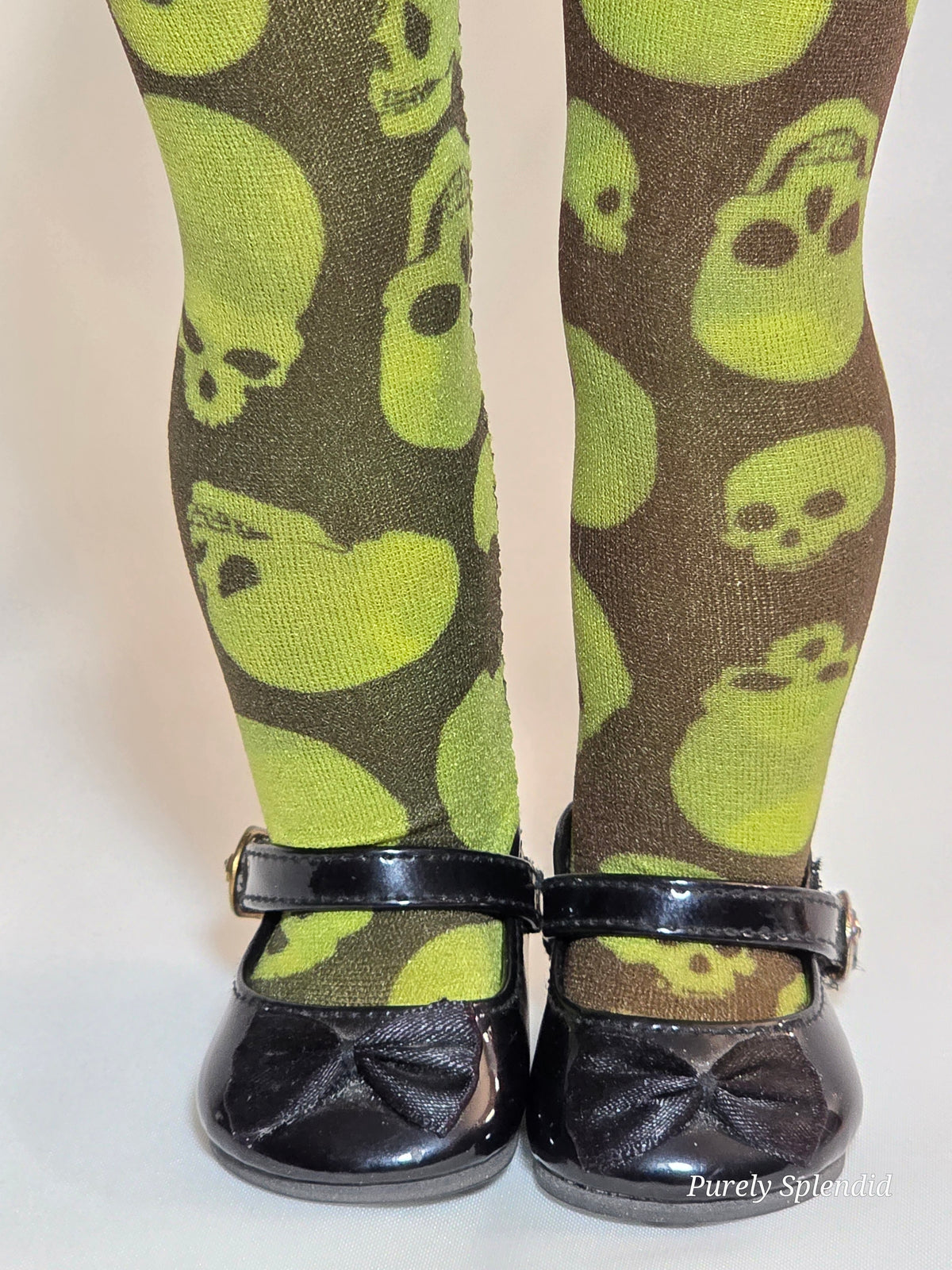18 inch girl doll wearing a pair of green Halloween Skull Tights / American made / Purely Splendid