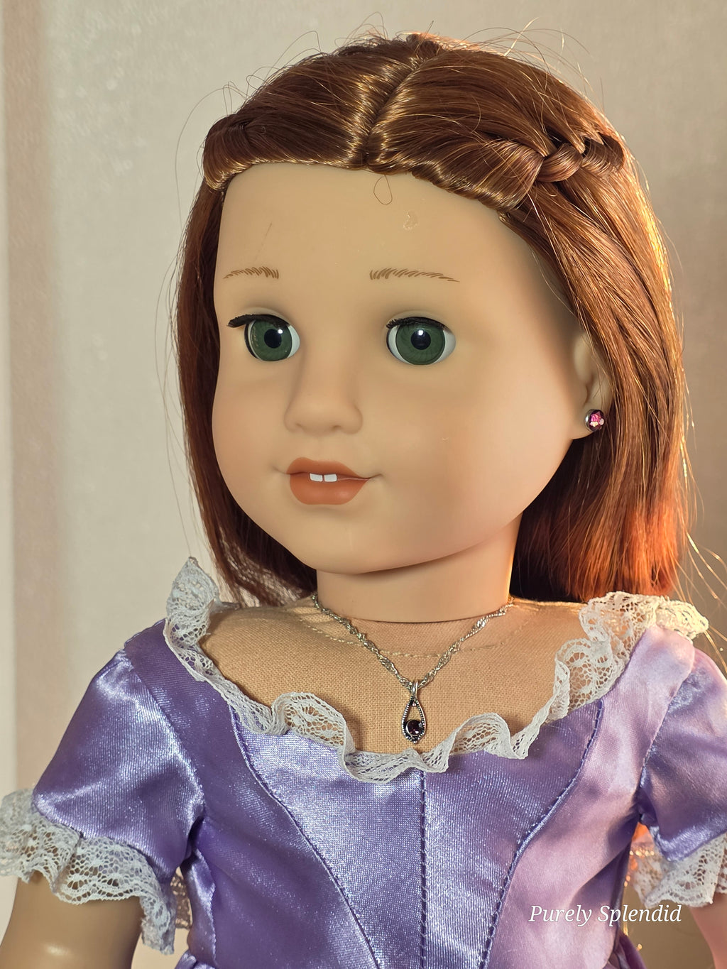 18 inch doll wearing a dainty amethyst pendant necklace on a silver twisted chain 