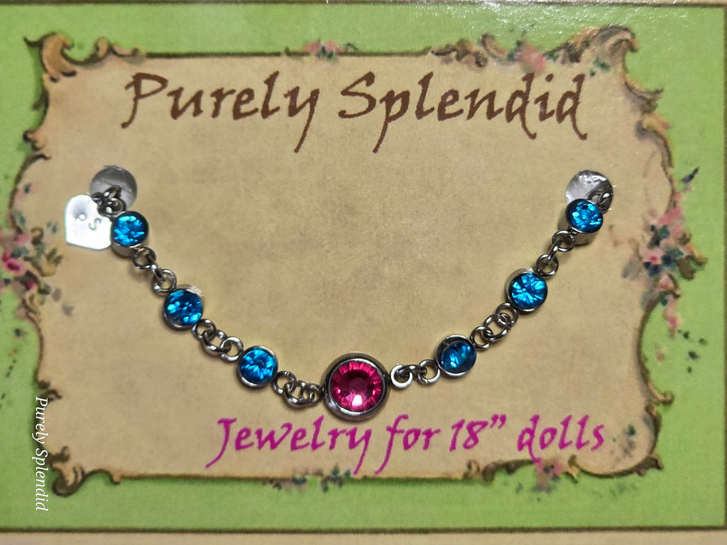 Dark Pink center stone surrounded by Baby Blue stones