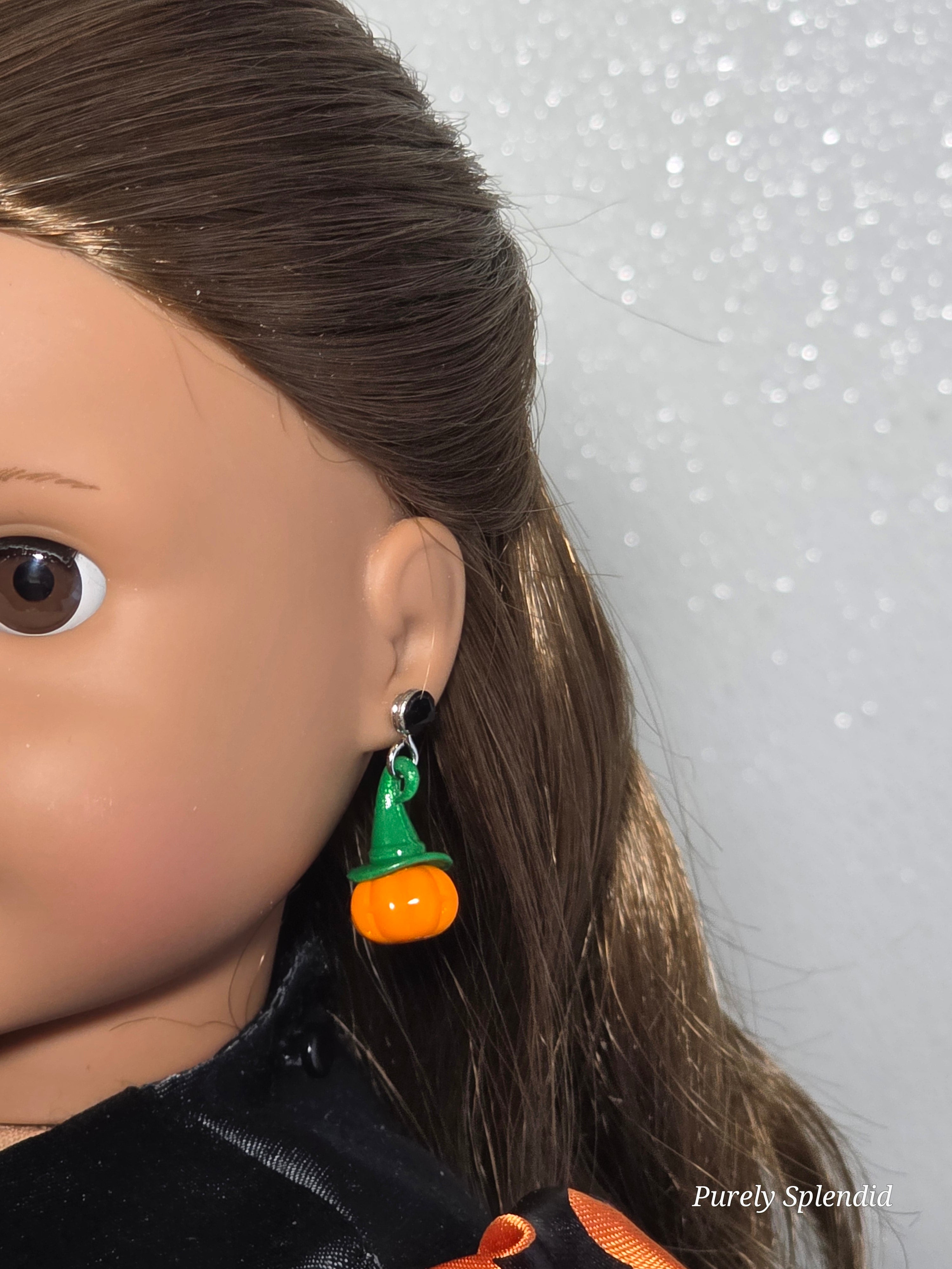 18 inch doll wearing pumpkin earrings