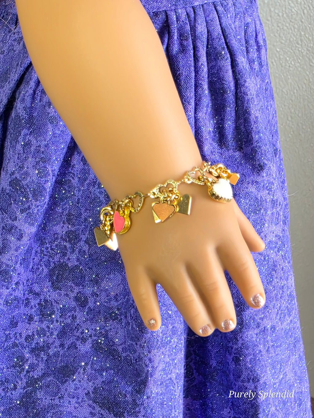 18 inch doll wearing Loaded Heart Charm Bracelet