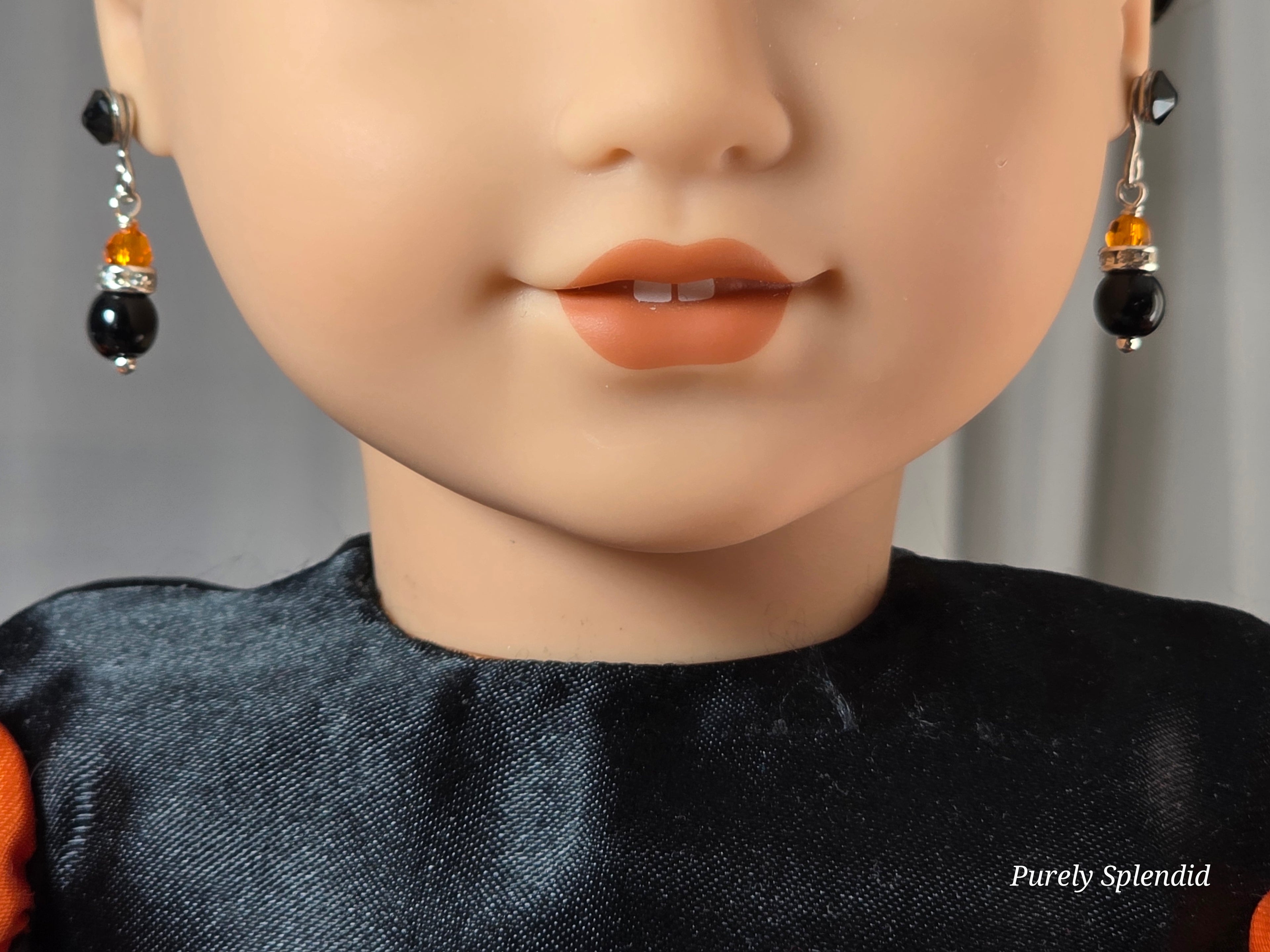 18 inch doll wearing a pair of Sparkling Halloween Earrings 
