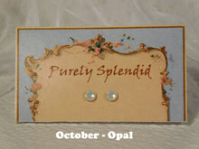 Load image into Gallery viewer, a pair of October Birthstone Opal Studs on a display card
