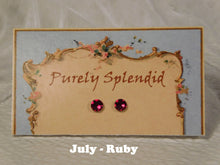 Load image into Gallery viewer, a pair of July Birthstone Ruby Studs on a display card

