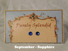 Load image into Gallery viewer, a pair of September Birthstone Sapphire Studs on a display card

