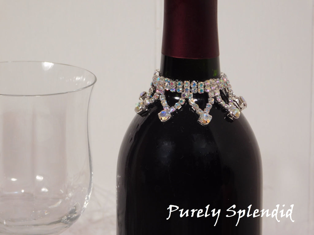 close up of the Sparkling Aurora Borealis Wine Bottle Bling Necklace on a standard size wine bottle, reusable