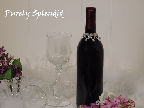 Sparkling Aurora Borealis Wine Bottle Bling Necklace shown on a standard size dark wine bottle