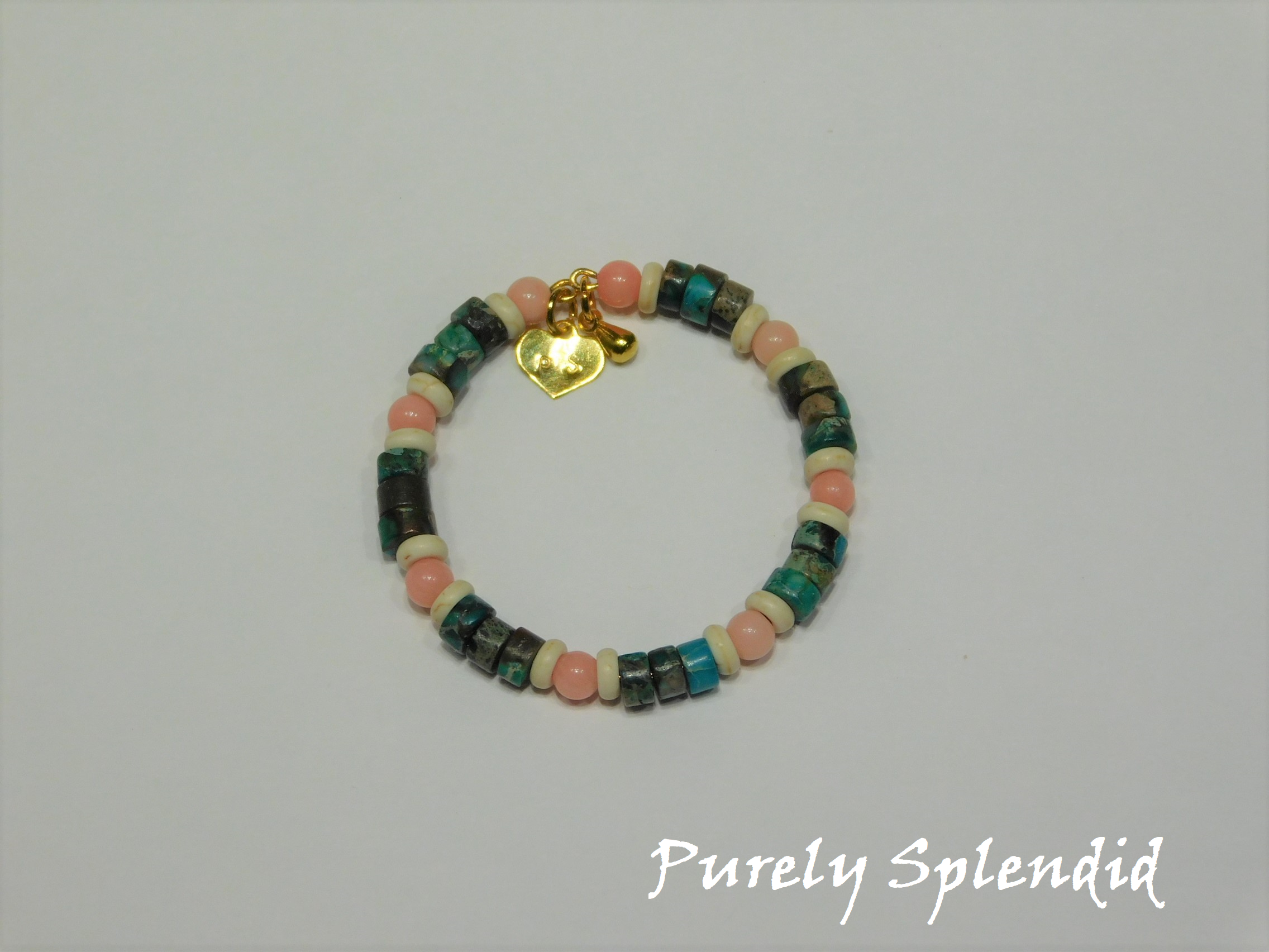 stone beads in green, brown, off white and coral make up this Beachy Stacking Bracelet for 18 inch dolls