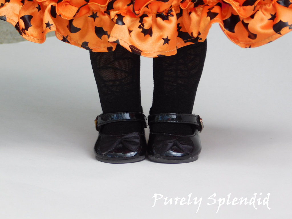 18 inch girl doll wearing spider web tights for Halloween witch costume
