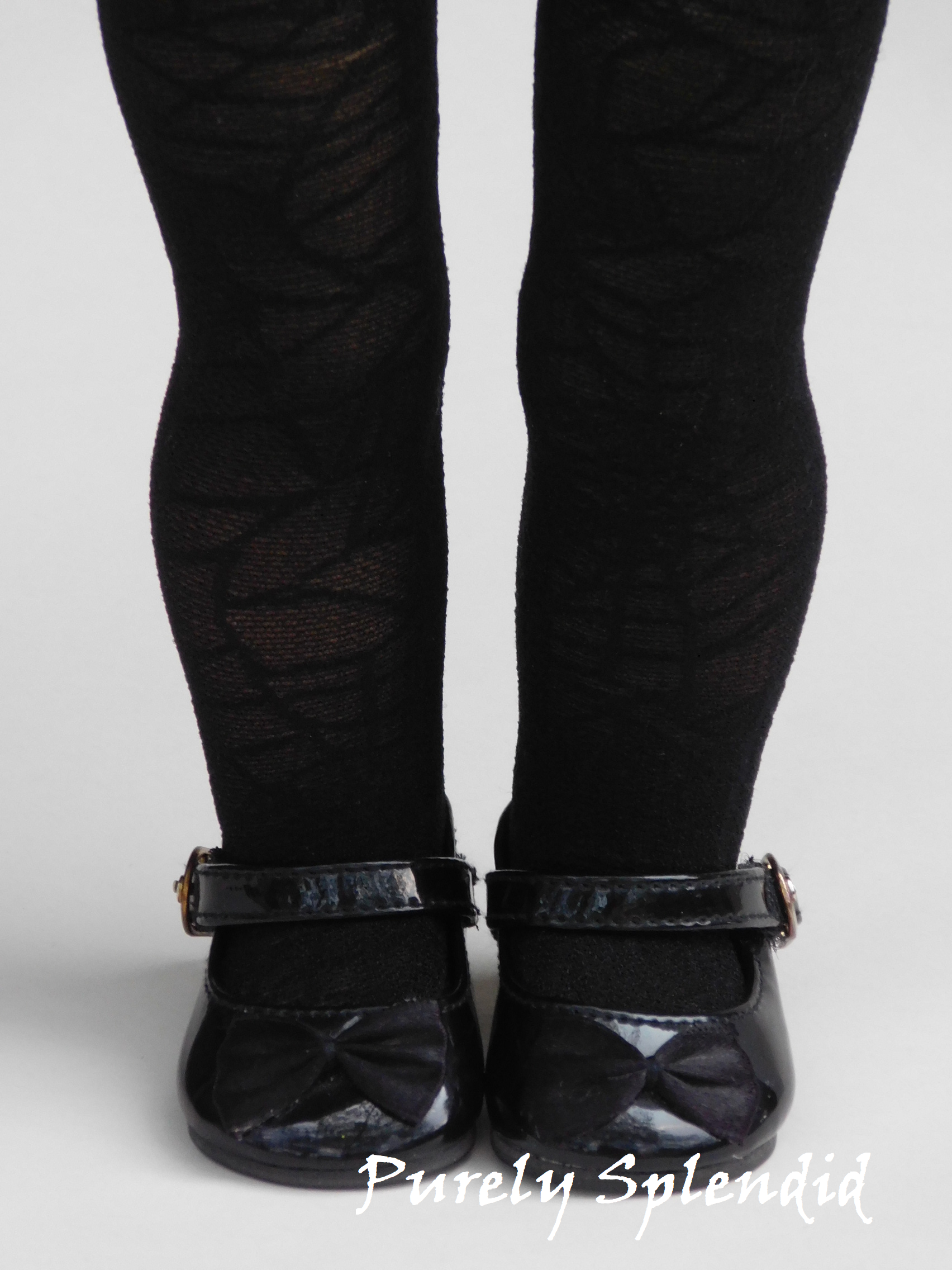18 inch girl doll wearing black spider web tights for Halloween costume
