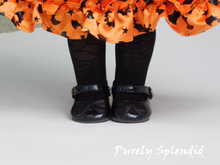 Load image into Gallery viewer, 18 inch doll shown wearing a pretty orange and black Halloween party dress along with a pair of black Spider Web Tights and black shoes
