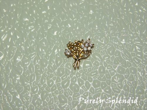 Gold tone and Cubic Zirconia flowers make up this Bouquet of Flowers Brooch