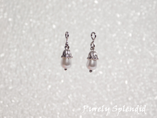 white teardrop pearls with a silver petal cap 
