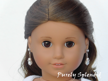 Load image into Gallery viewer, 18 inch doll shown wearing a pair of Budding Pearl Earrings. Pear shaped pearl like beads are nestled in a silver flower cup.
