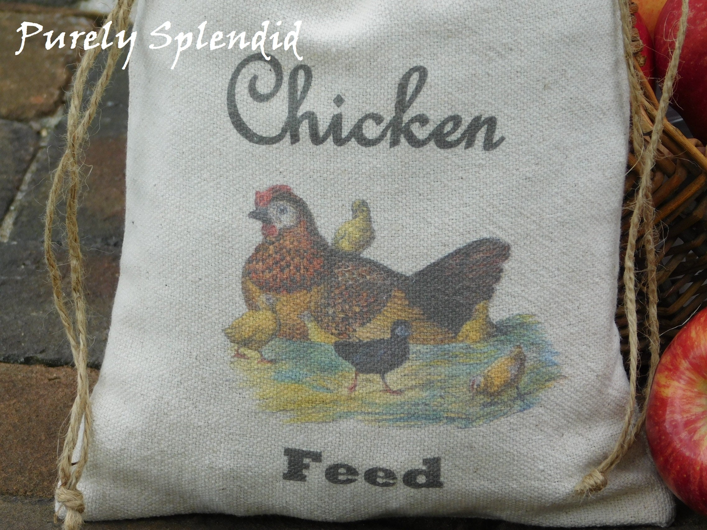 close up of a Mother Hen sitting on her nest with her chicks and the words Chicken Feed printed on the bag