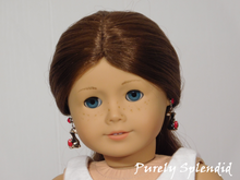 Load image into Gallery viewer, 18 inch doll shown wearing a pair of the Chocolate Bunny Earrings with the bunnies facing away from her head
