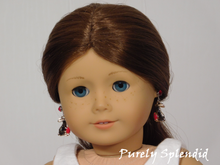 Load image into Gallery viewer, 18 inch doll shown wearing a pair of the Chocolate Bunny Earrings with the bunnies facing her head.
