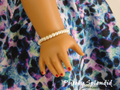 18 inch doll wearing a single strand Classic Pearl Bracelet