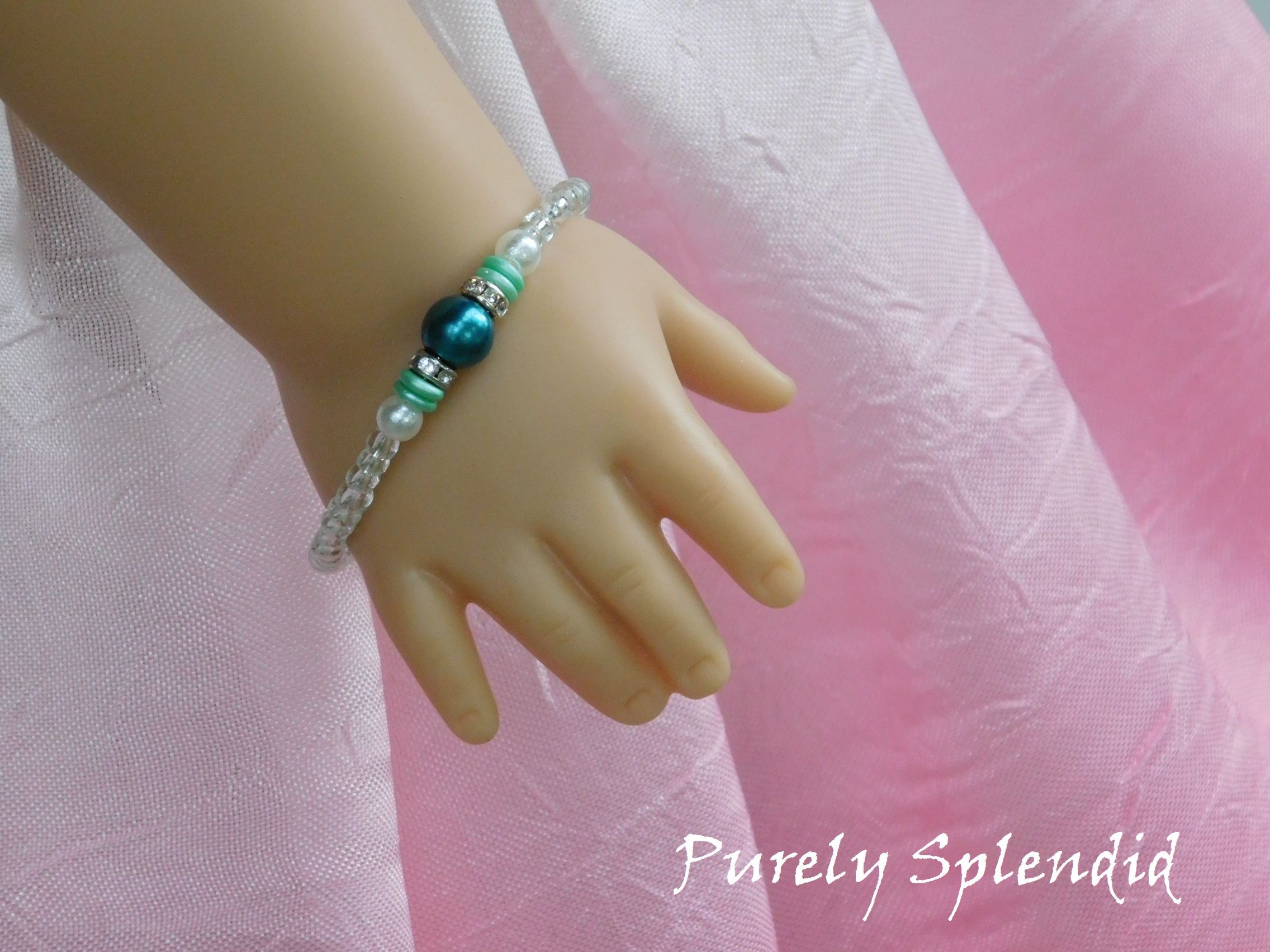 Crystal Stacking Bracelet with Teal accents as shown on an 18 inch doll