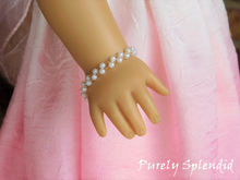 Load image into Gallery viewer, Dainty Pearl Bracelet double row shown on an 18 inch doll who has a wrist measuring 3 1/4&quot;
