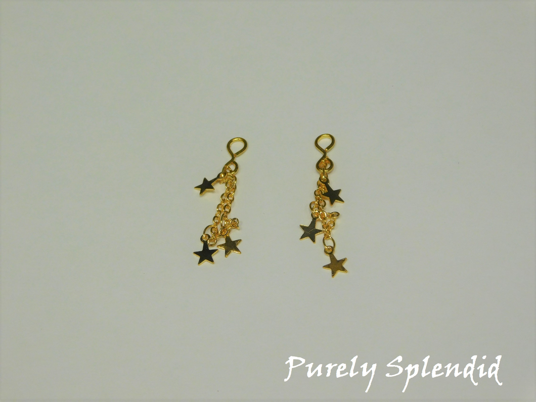 Gold Star Earrings on a white background