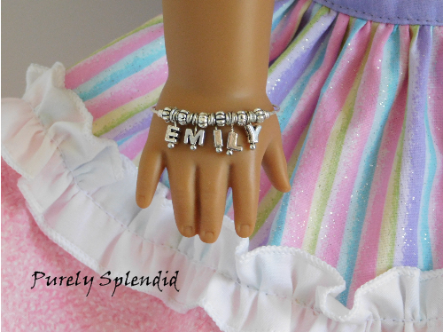 American Girl Doll shown wearing a Name Bracelet with the name Emily