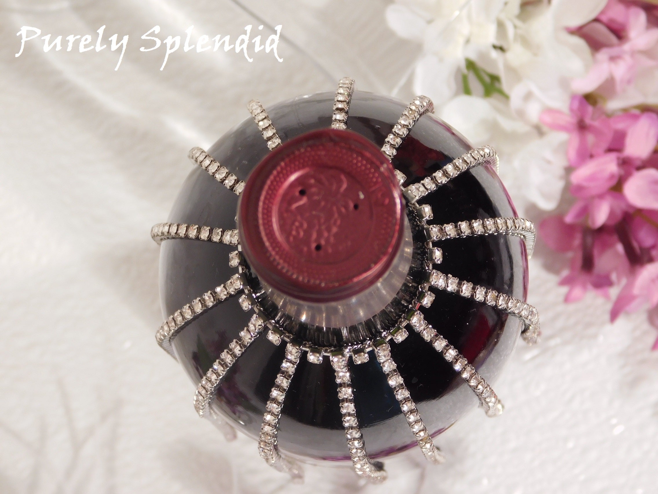 overhead view of the Sparkling Falling Rhinestone Bottle Bling on a standard dark wine bottle