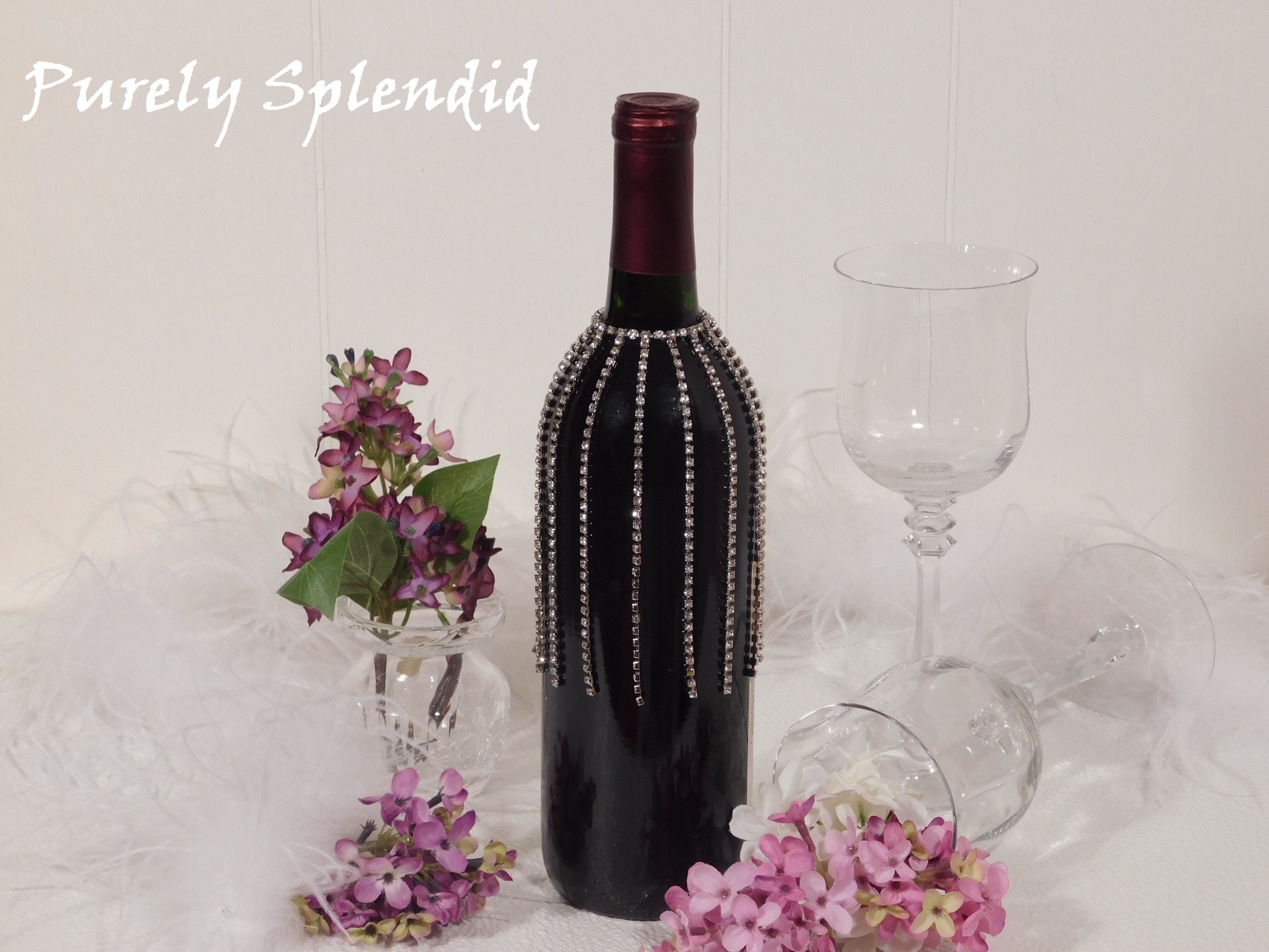 Sparkling Falling Rhinestone Bottle Bling shown on a standard size dark wine bottle