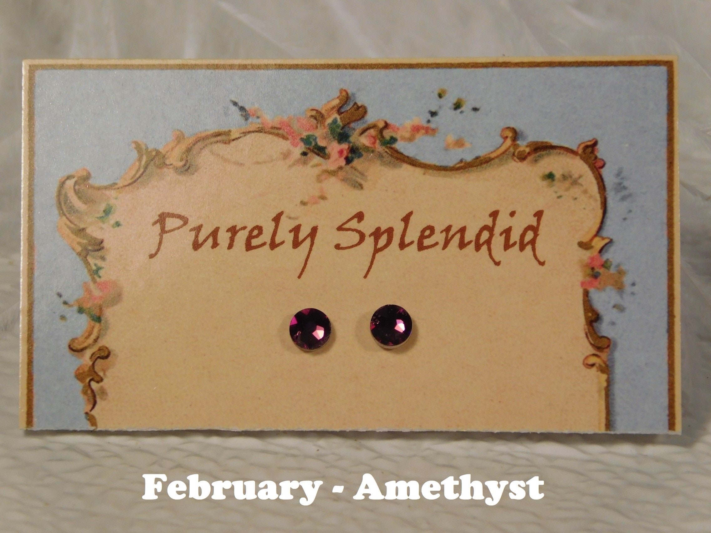 a pair of February Birthstone Amethyst Studs for 18 inch dolls
