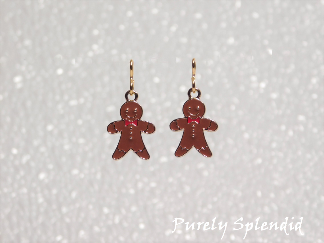 happy brown ginerbread men with a red bow