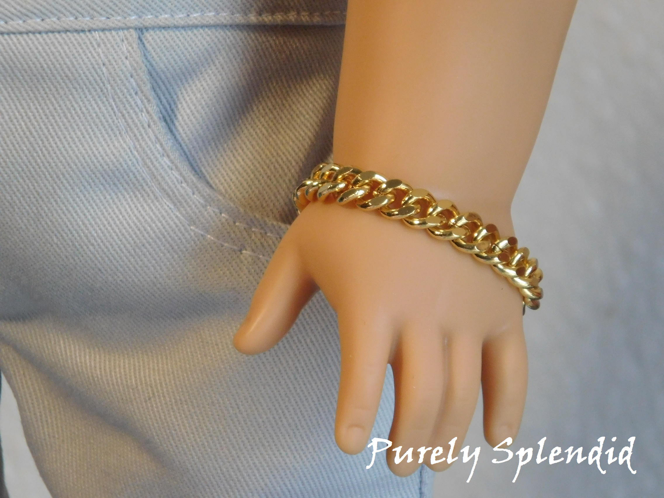 18 inch boy doll shown wearing a Gold Chain Bracelet