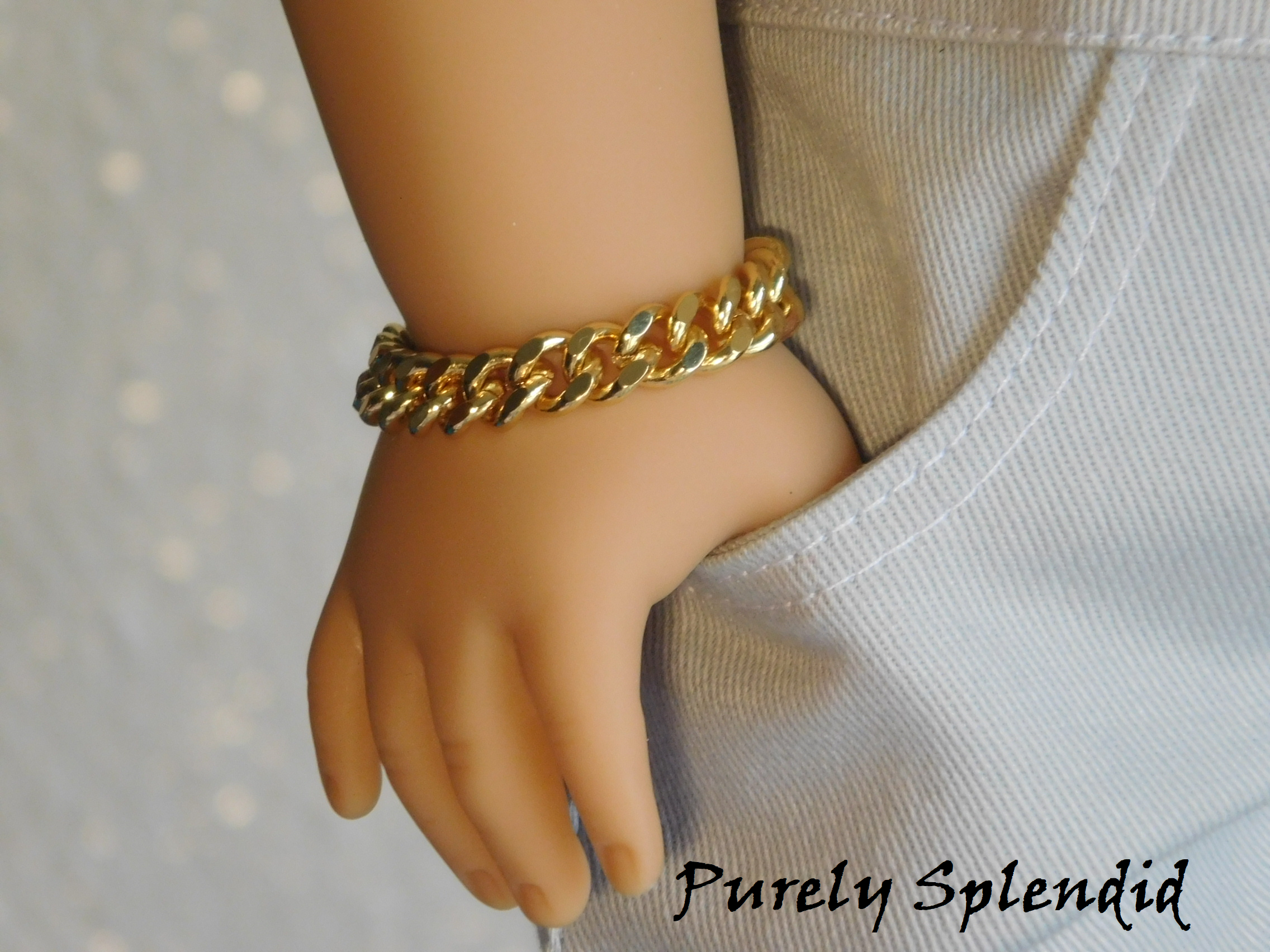 18 inch boy doll shown wearing a Gold Chain Bracelet with his hand in his pocket