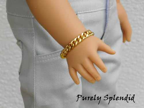 18 inch boy doll shown wearing a Gold Chain Bracelet