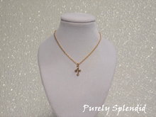 Load image into Gallery viewer, Beautiful dainty Gold Cross Necklace with a touch of sparkle on a fine gold colored chain
