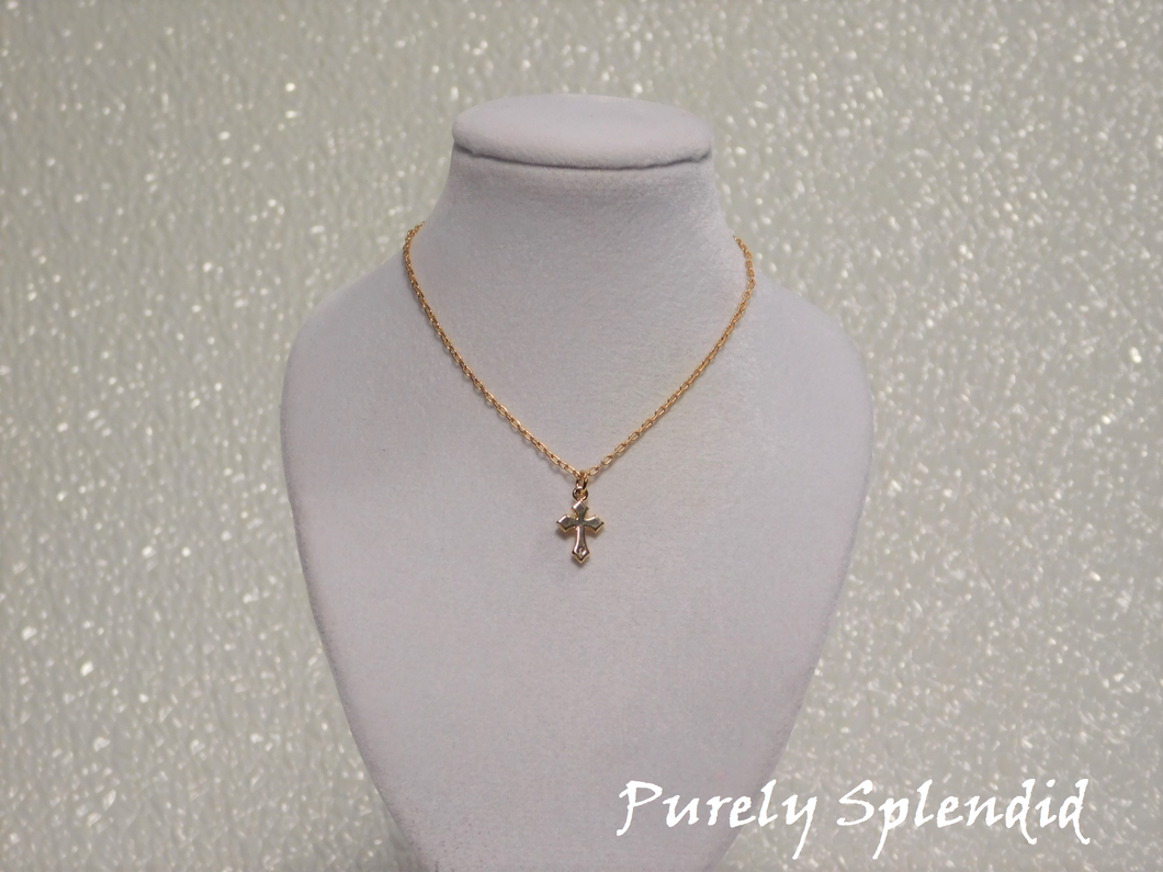 Beautiful dainty Gold Cross Necklace with a touch of sparkle on a fine gold colored chain