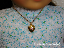 Load image into Gallery viewer, Heart Necklace with a pink center stone shown worn by an 18 inch doll
