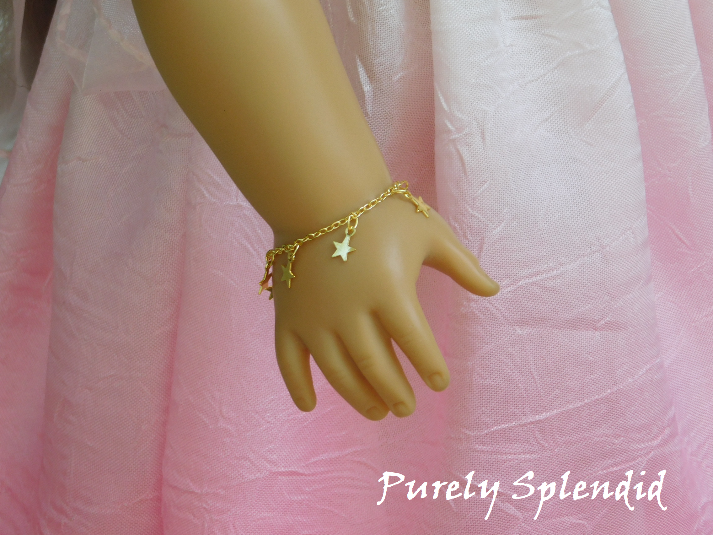 Gold Star Bracelet shown on an 18 inch doll