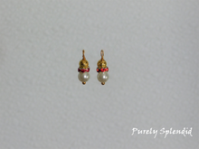 Load image into Gallery viewer, a beautiful glass pearl topped with a ring of red rhinestones and lovely gold bead shown as earring dangles for dolls who wear 2mm studs
