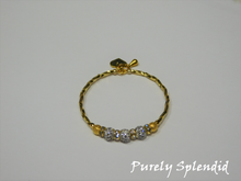 Load image into Gallery viewer, Gold bracelet with three round sparkling silver beads each surrounded with a ring of sparkle

