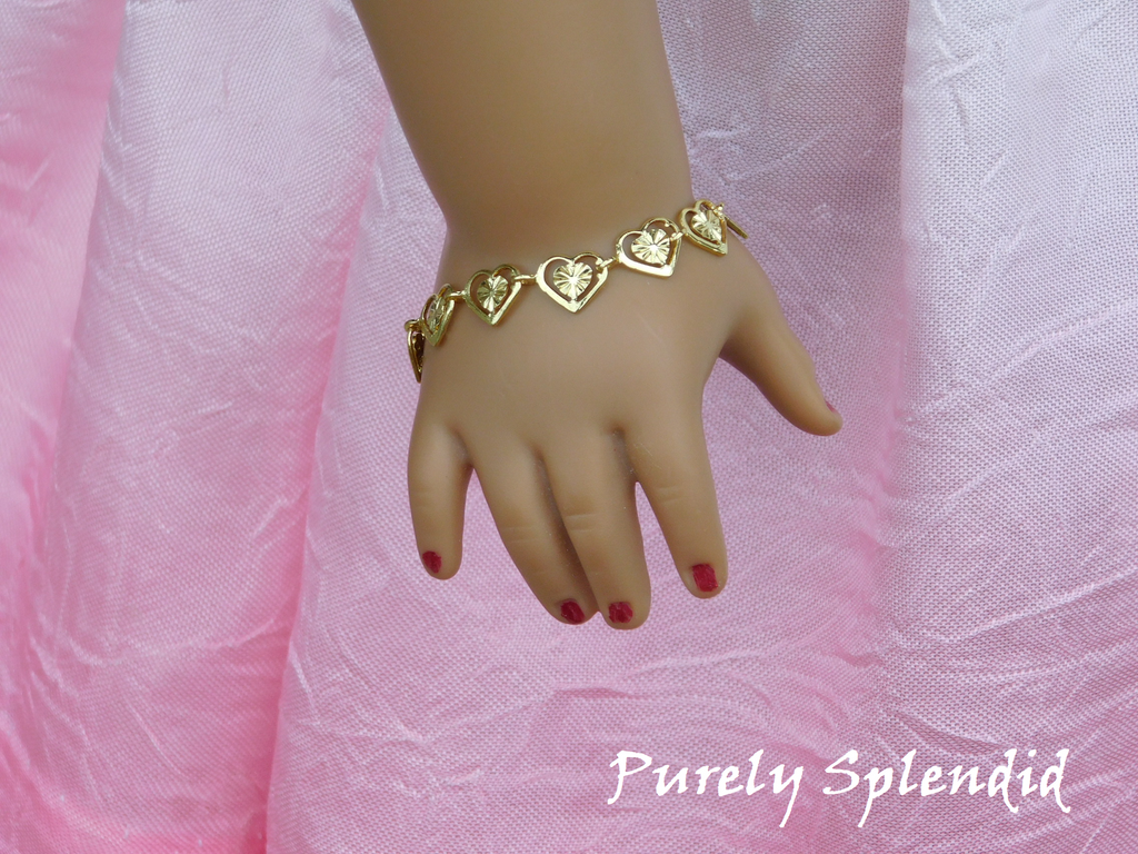 Golden filigree hearts make up this pretty Golden Heart Bracelet 