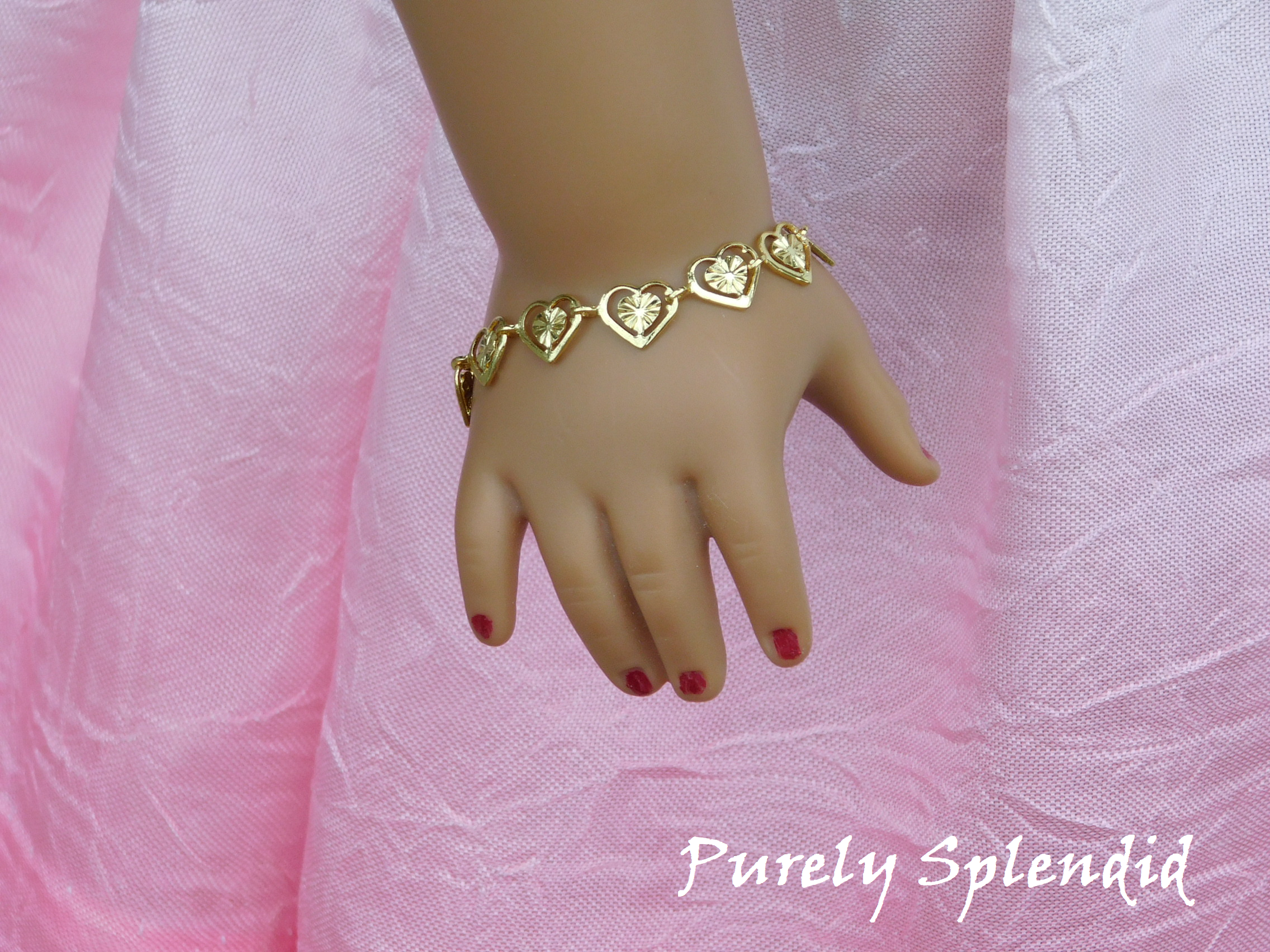 Golden filigree hearts make up this pretty Golden Heart Bracelet 