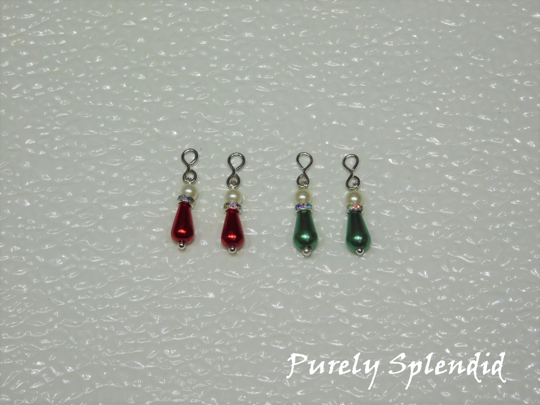 two pairs of Holiday Pearl Earrings one red pair and one green pair -long pear shaped pearl bead topped with a thin sparkling bead and large round white pearl bead 