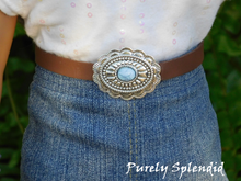 Load image into Gallery viewer, Large silver Conchos with blue center gem on a brown belt

